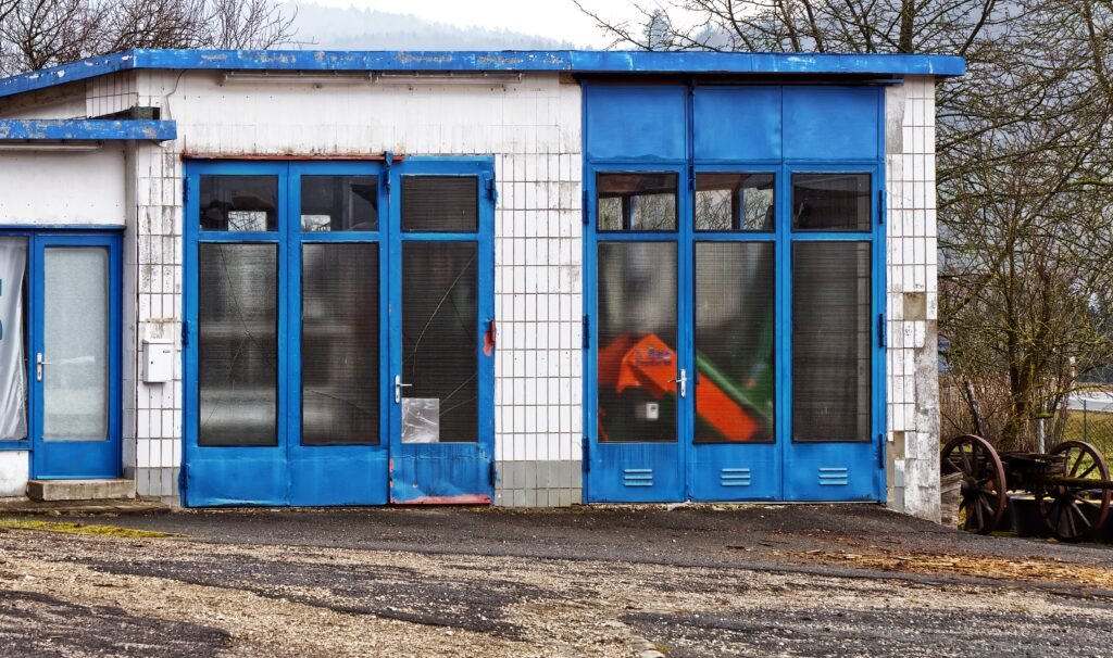 Garage door safety sensors mounted on both sides of the door opening